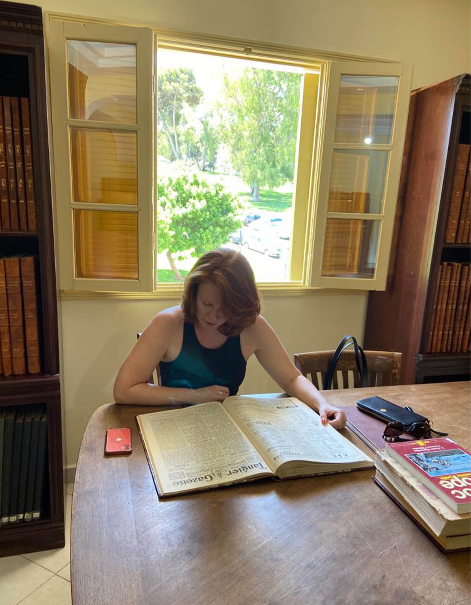 Researcher consulting a book